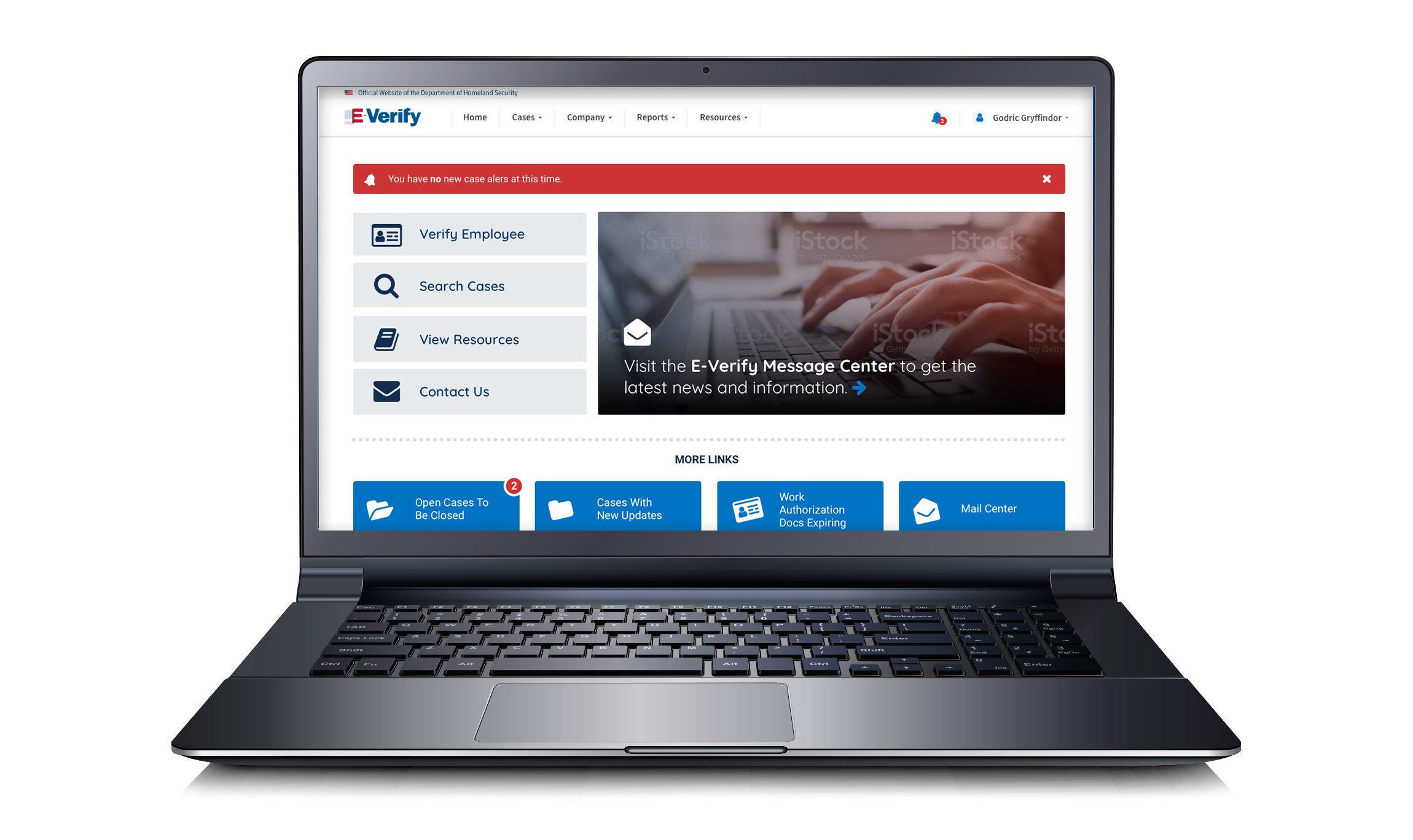 Photo of a laptop with the E-Verify website.